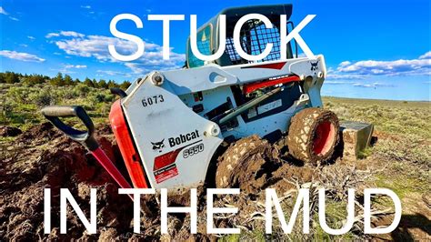 bobcat skid steer stuck in mud|bob cat kubota skid steer stuck.